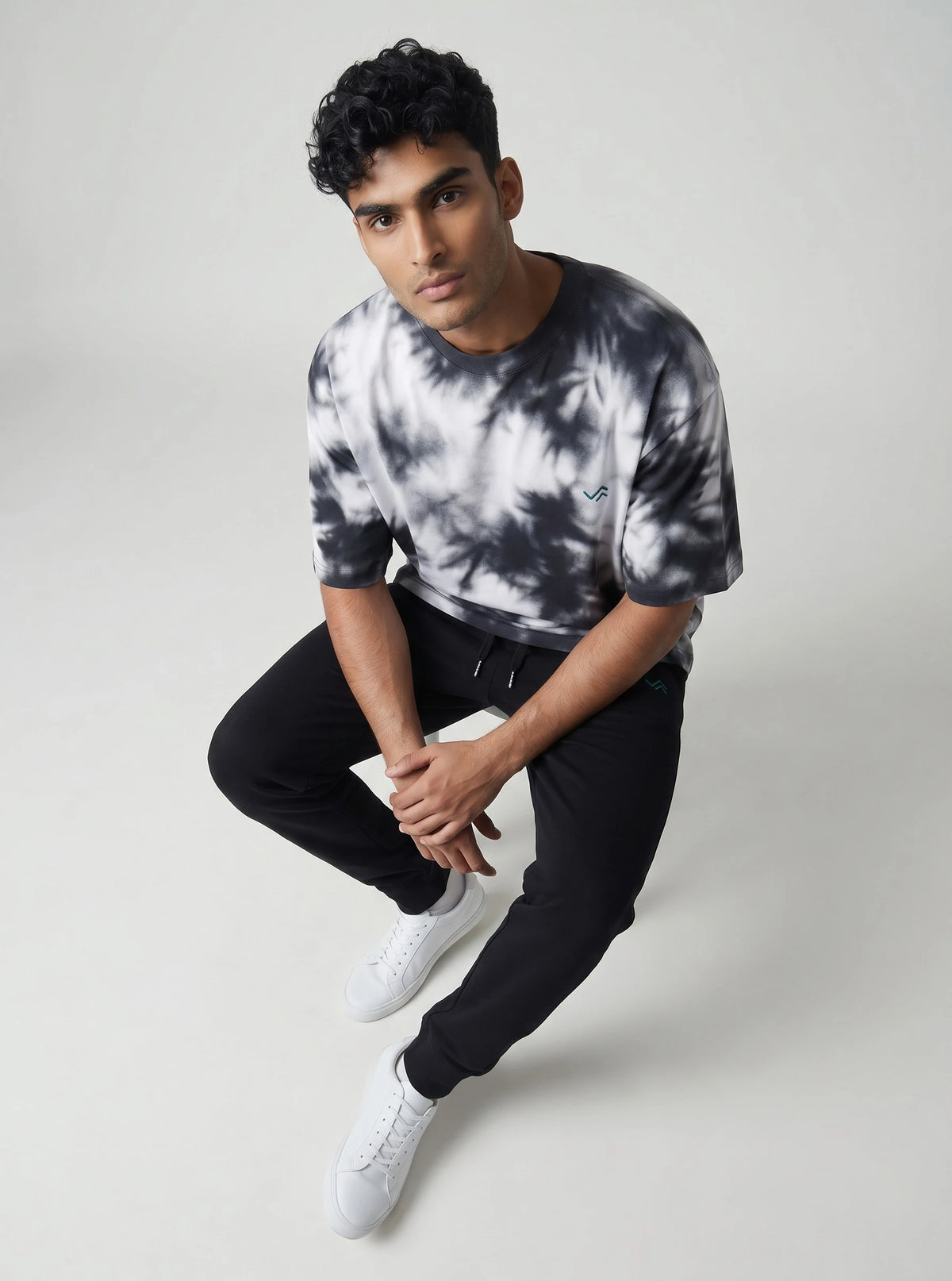 Unisex athleisure set with black and white tie-dye oversized tee and black melange joggers