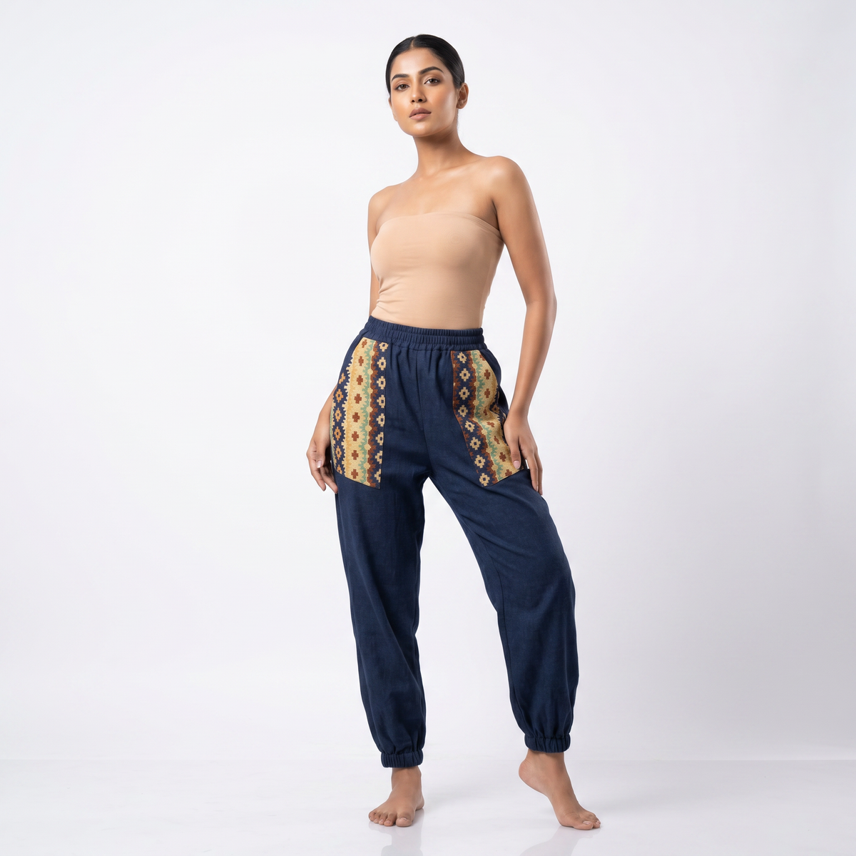 Navy cotton hopper pants for women showing woven side pockets and gathered ankles