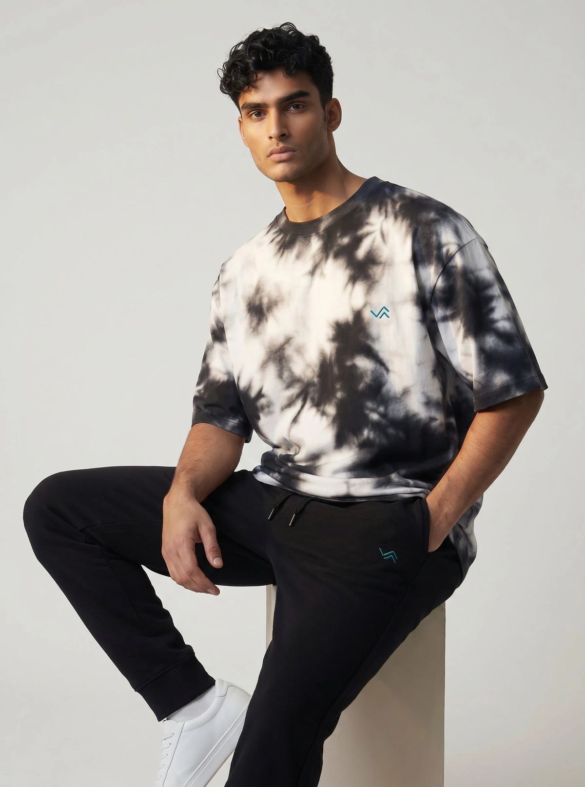 Unisex athleisure set with black and white tie-dye oversized tee and black melange joggers