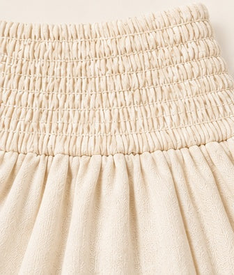 Ivory Smocked Waist Ruffle Mini Skirt with Geometric Print