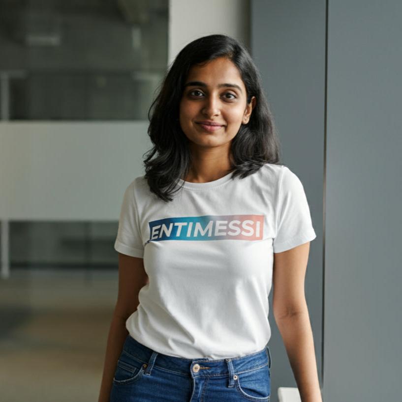 A young woman, dressed in a custom crew-neck t-shirt, stands confidently in a corporate office setting